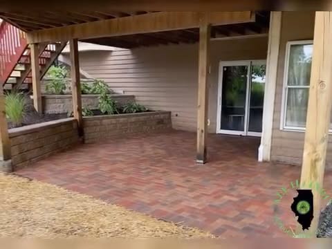 Brick patio beside a home and covered outdoor area